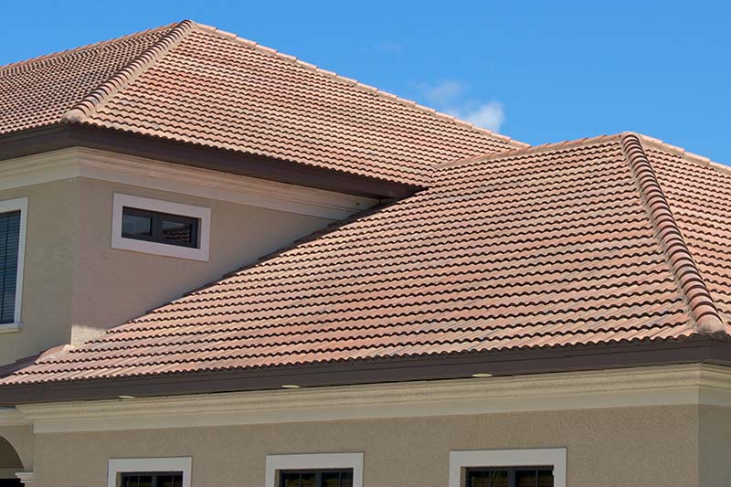 home inspection services being preformed on the roof of a Florida house